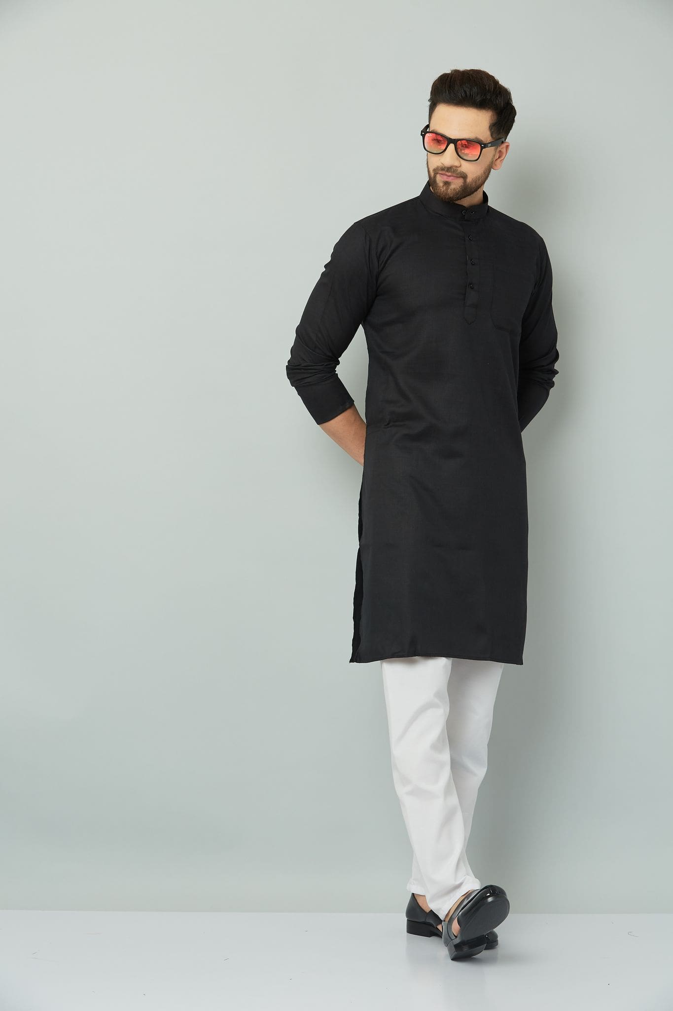 Black kurta set for men with elegant design.